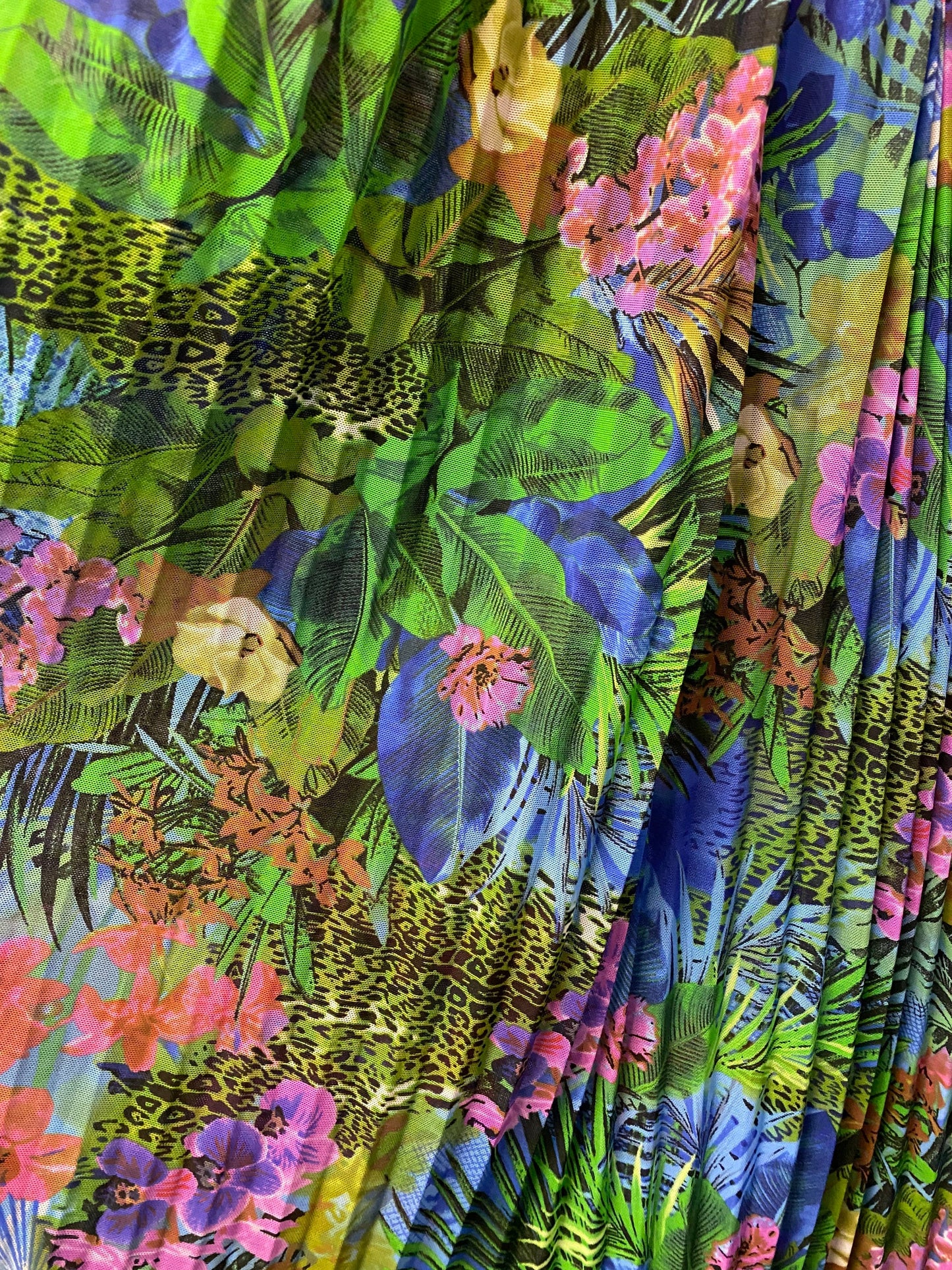 New Hiding Exotic Leopard design print on pleated power mesh 4-way stretch 58/60” Sold by the YD. Ships worldwide from Los Angeles CA USA.