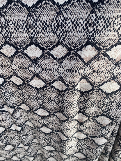 New exotic snake design print on poly spandex medium weight 2-way stretch 58/60” Sold by the YD. Ships worldwide from Los Angeles California