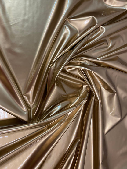 New latex gold shining 4-way stretch 58/60” Sold by the YD. Ships worldwide from Los Angeles California USA.