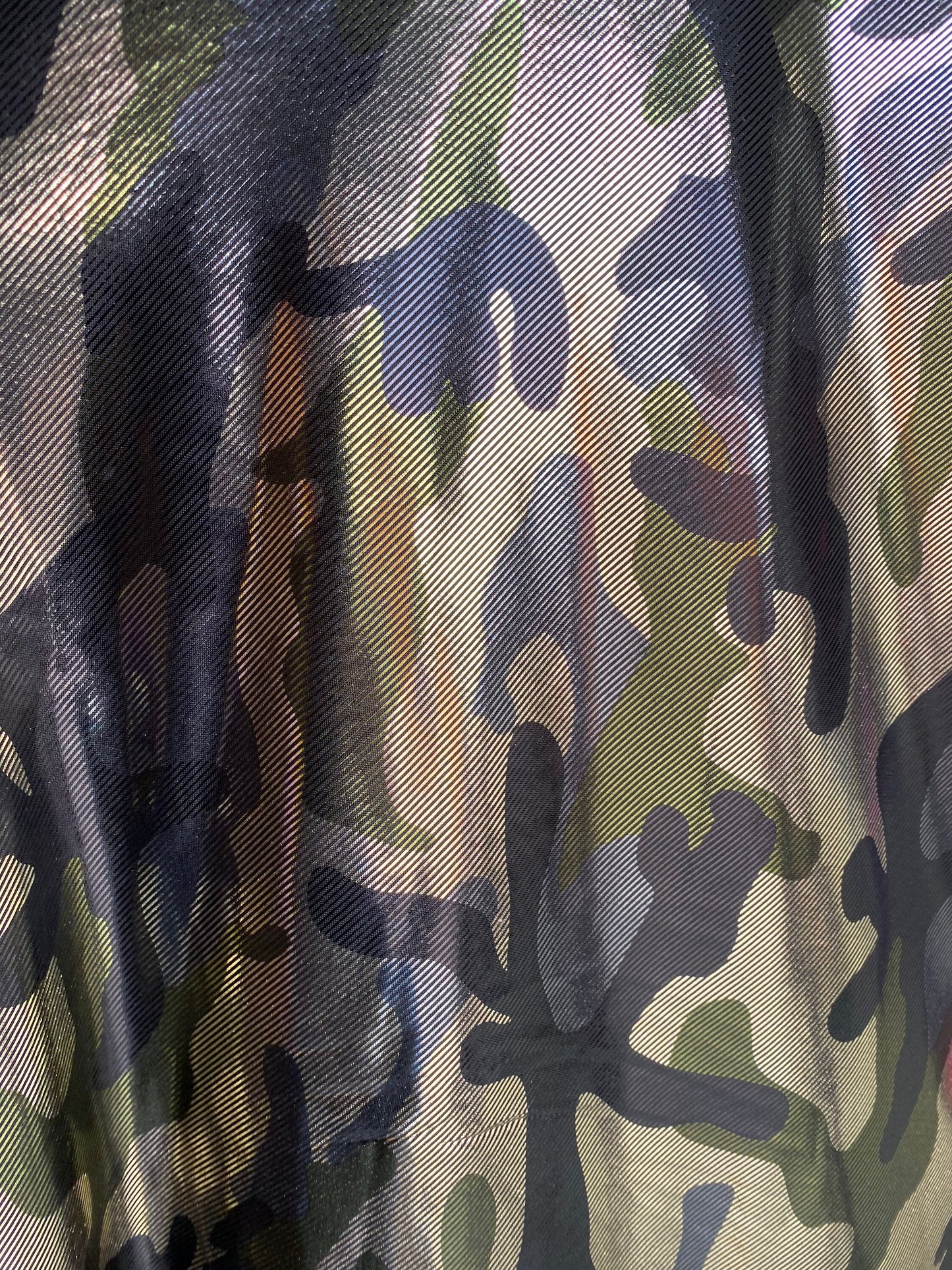 Camouflage army color metallic nylon spandex 4-way stretch 58/60” Sold by the YD. Ships worldwide from Los Angeles California USA.