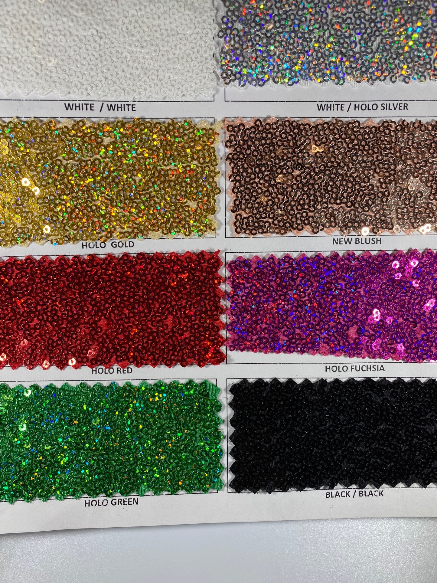 New Cosmic glitz sequins embroidered holographic micro sequins on solid spandex 4-way stretch 54/55” Sold by the YD.