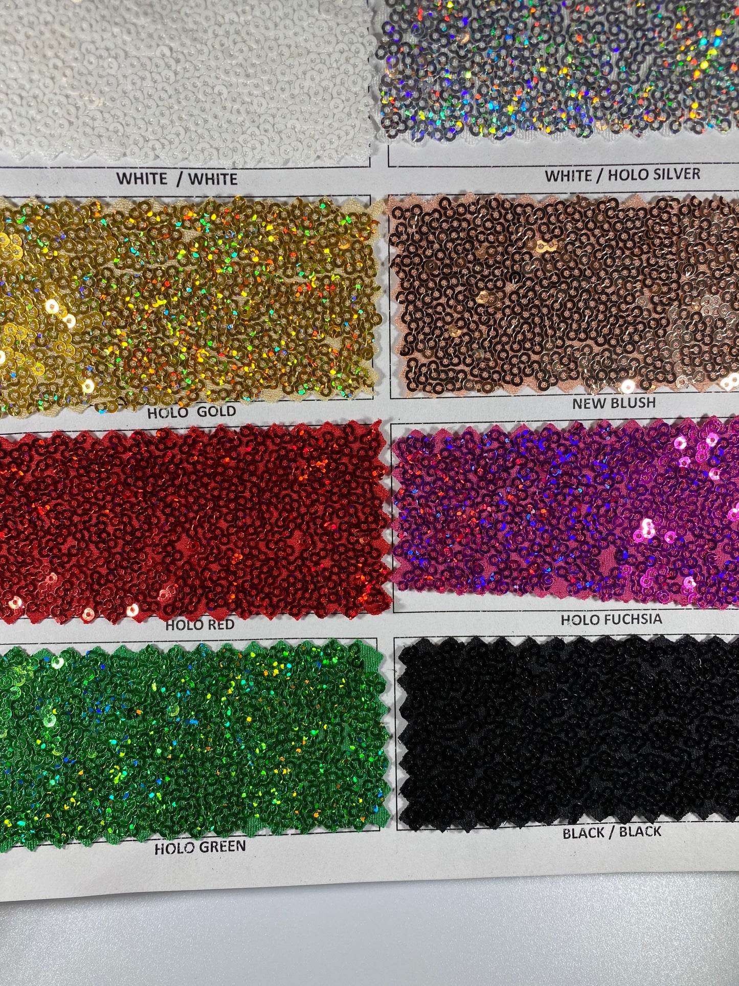 New Cosmic glitz sequins embroidered holographic micro sequins on solid spandex 4-way stretch 54/55” Sold by the YD.