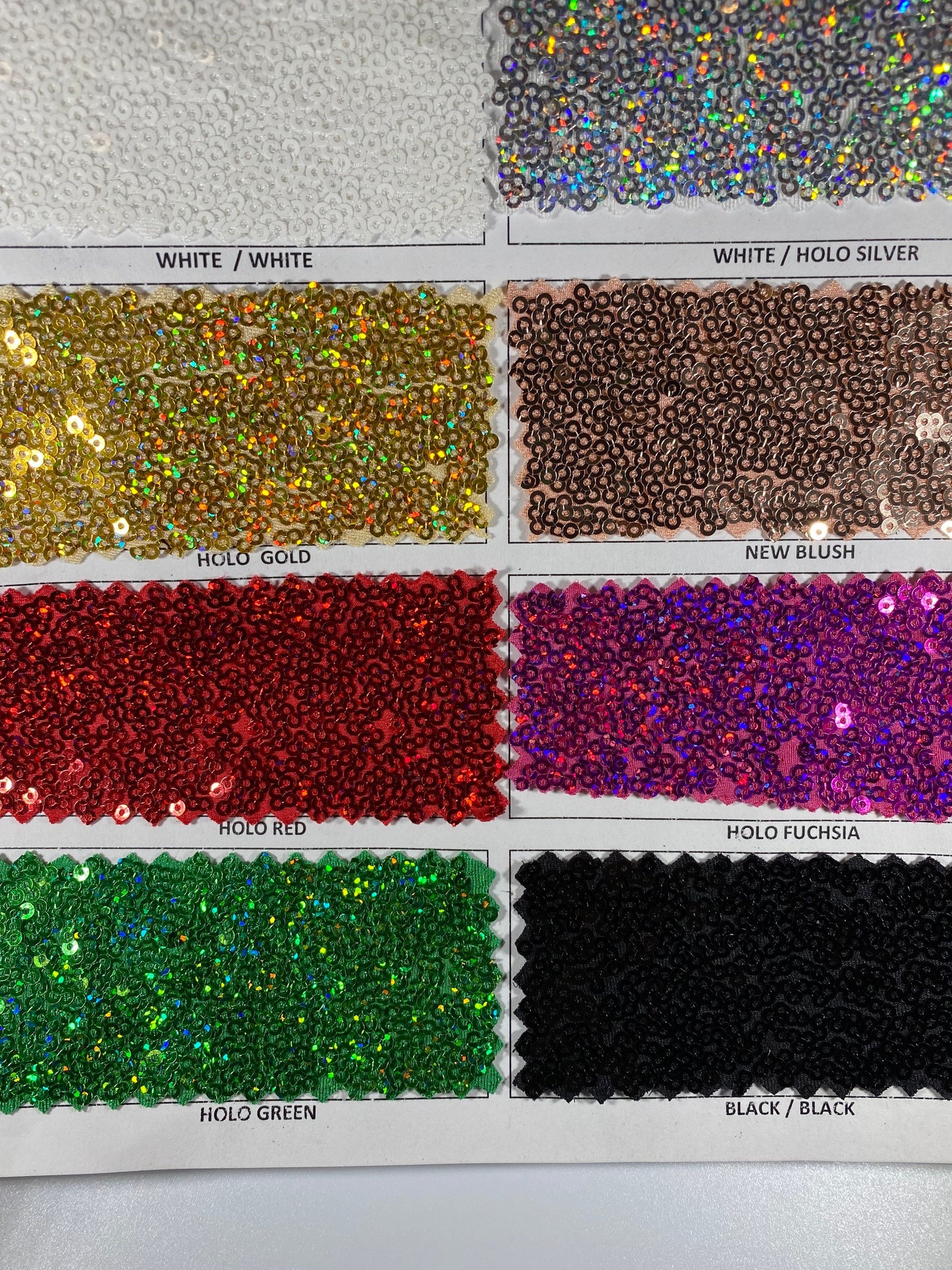 New Cosmic glitz sequins embroidered holographic micro sequins on solid spandex 4-way stretch 54/55” Sold by the YD.