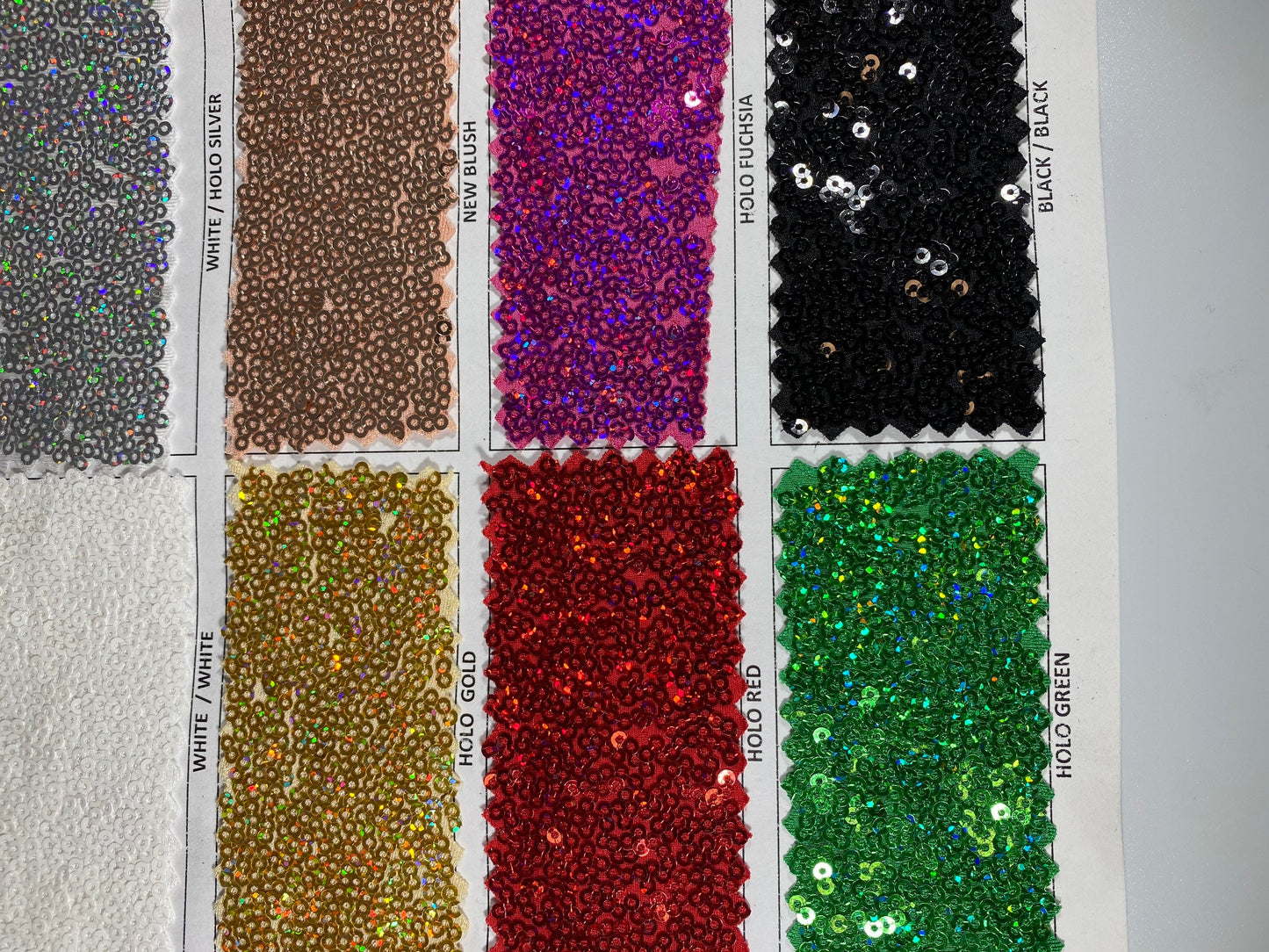 New Cosmic glitz sequins embroidered holographic micro sequins on solid spandex 4-way stretch 54/55” Sold by the YD.