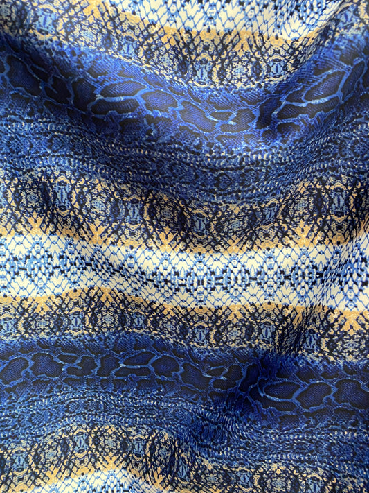 New Exotic snake design Sapphire/gold/beige print on poly techno spandex 2-way stretch 58/60” Sold by the YD. Ships worldwide from L.A CA