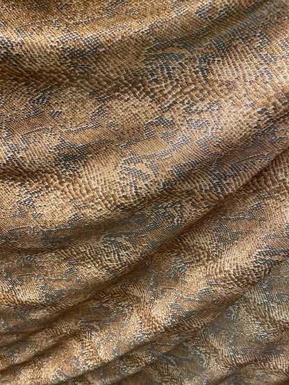 New exotic snake design metallic hologram poly spandex bronce color médium weight 2-way Stretch 58/60" Sold by the YD. Ships worldwide