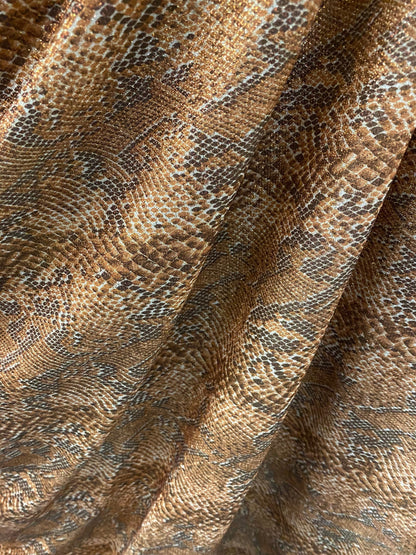 New exotic snake design metallic hologram poly spandex bronce color médium weight 2-way Stretch 58/60" Sold by the YD. Ships worldwide