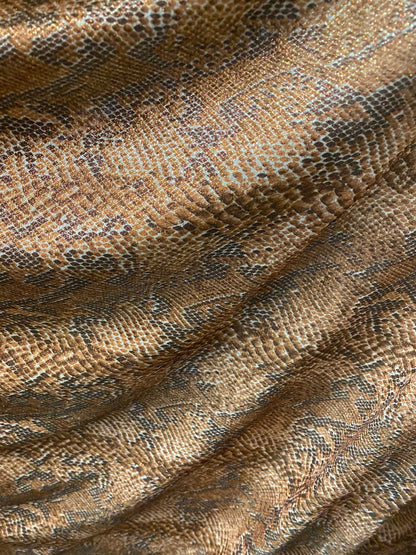 New exotic snake design metallic hologram poly spandex bronce color médium weight 2-way Stretch 58/60" Sold by the YD. Ships worldwide