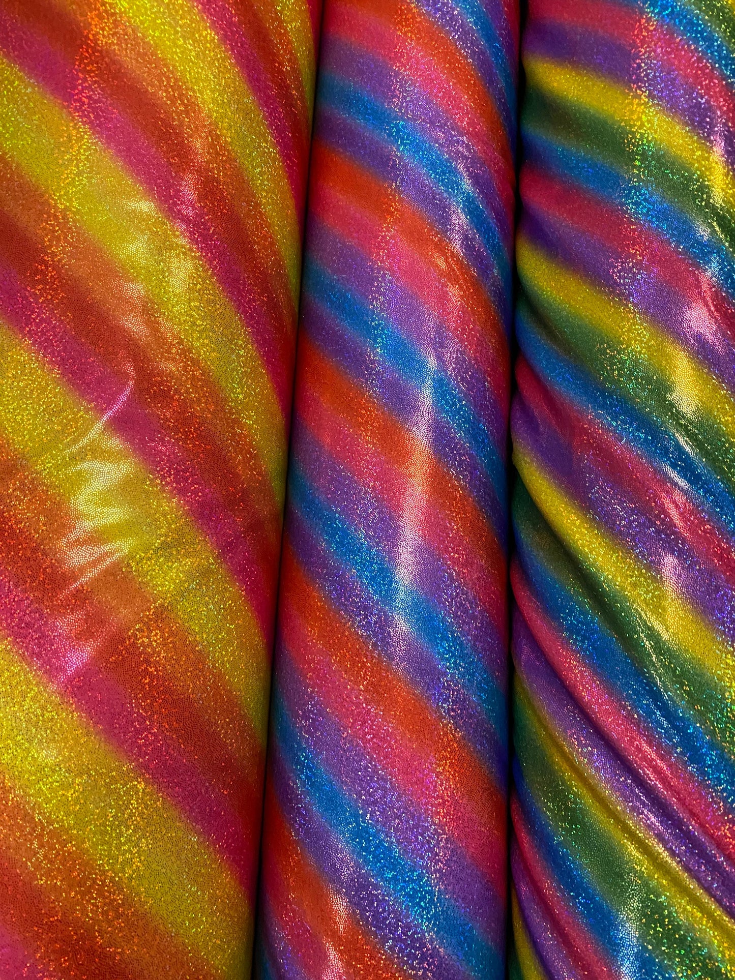 New Luxury rainbow with foggy hologram foil metallic nylon spandex 4-way stretch 58/60” Sold by the YD. Ships worldwide from L.A