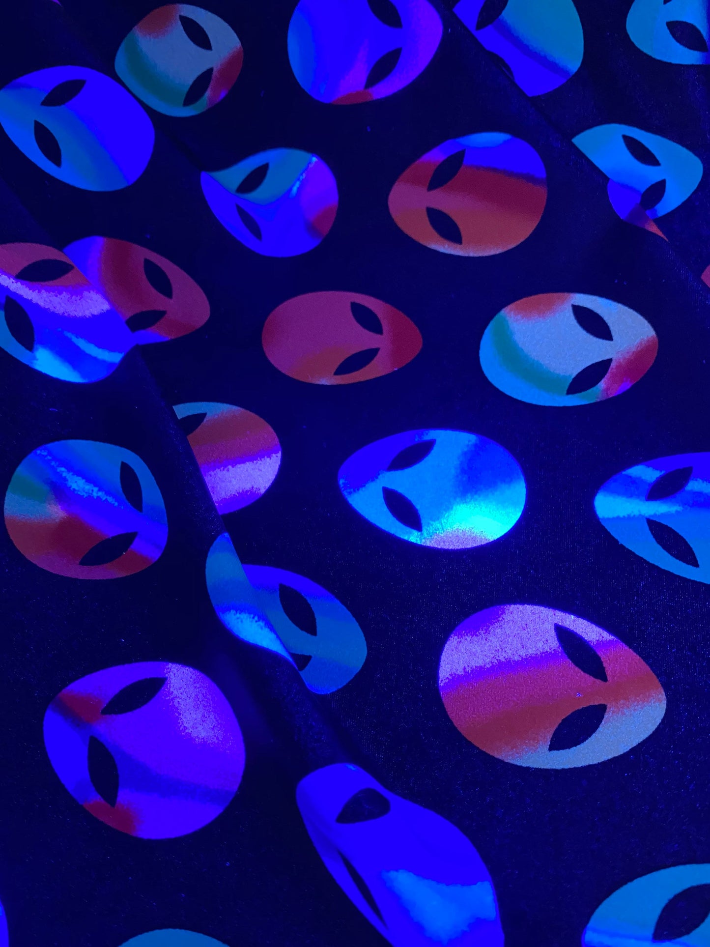 Nylon spandex Alien design it glows in the dark 4way stretch 58/60" sold by the yd. Ships worldwide from Los Angeles California USA
