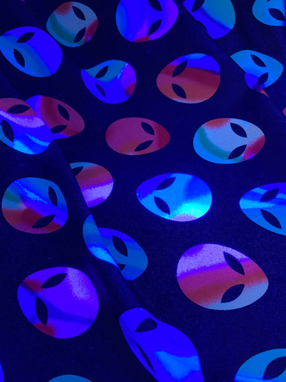Nylon spandex Alien design it glows in the dark 4way stretch 58/60" sold by the yd. Ships worldwide from Los Angeles California USA
