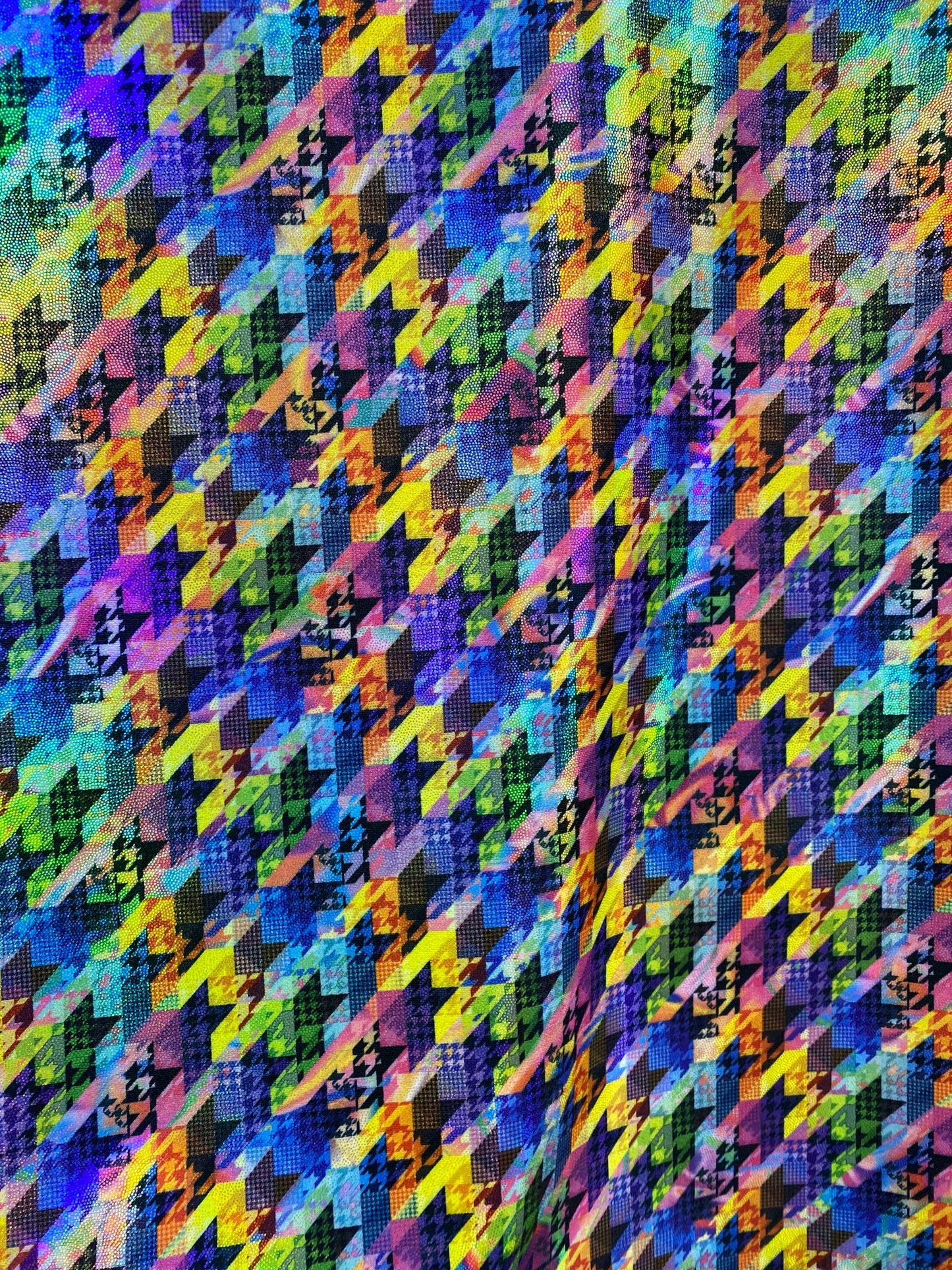 New modern houndstooth rainbow design digital foil print lacer hologram metallic nylon spandex 4-way stretch 58/60” Sold by the YD.