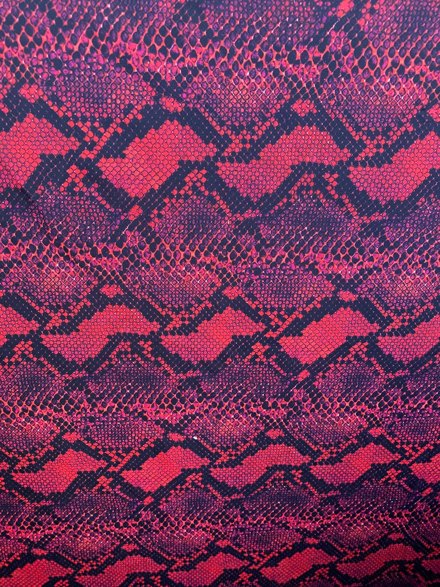 Serpent design Red/black print on nylon spandex 4-way stretch 58/60” Sold  by the YD. Ships worldwide from Los Angeles California USA.