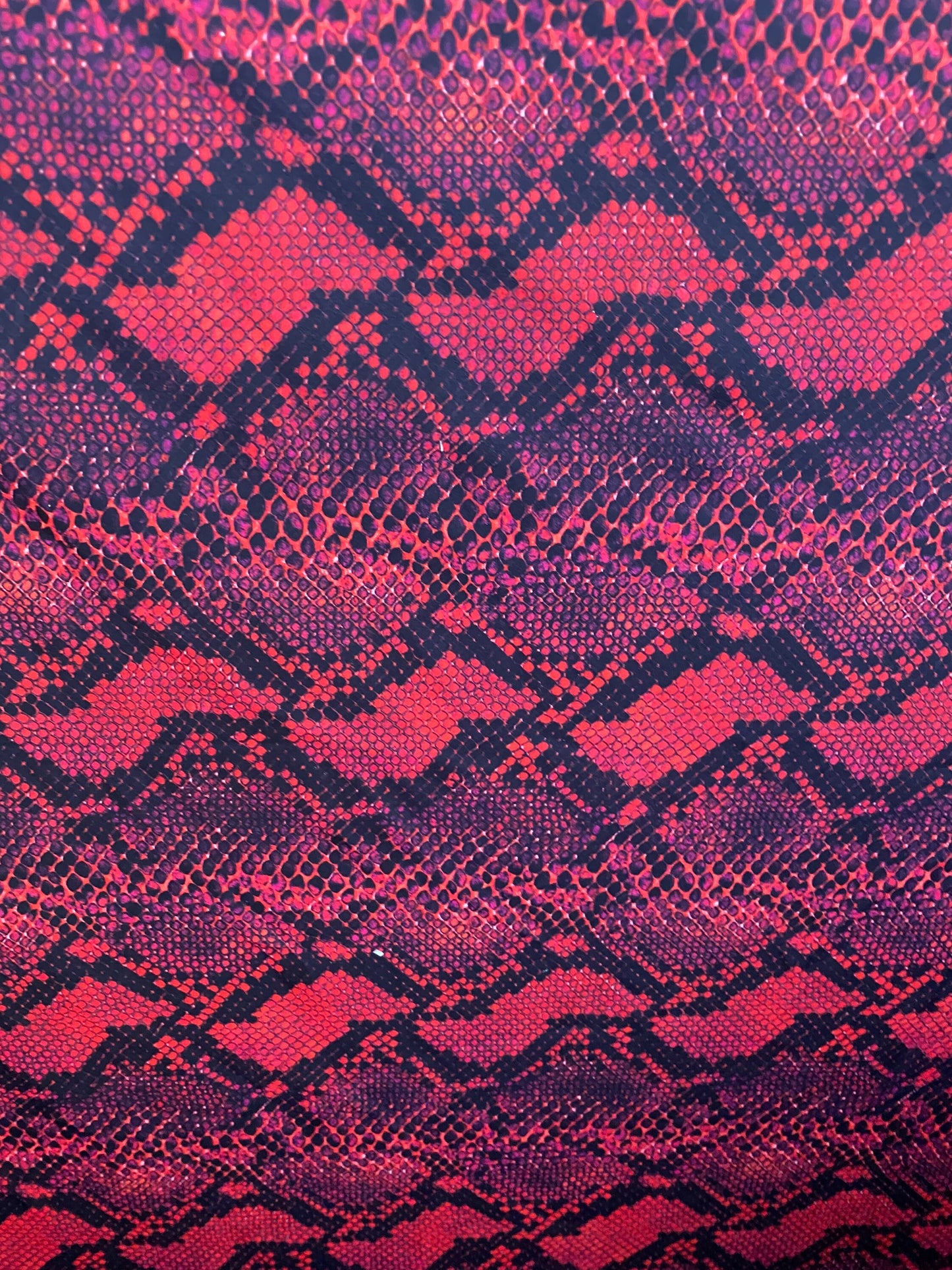 Serpent design Red/black print on nylon spandex 4-way stretch 58/60” Sold  by the YD. Ships worldwide from Los Angeles California USA.