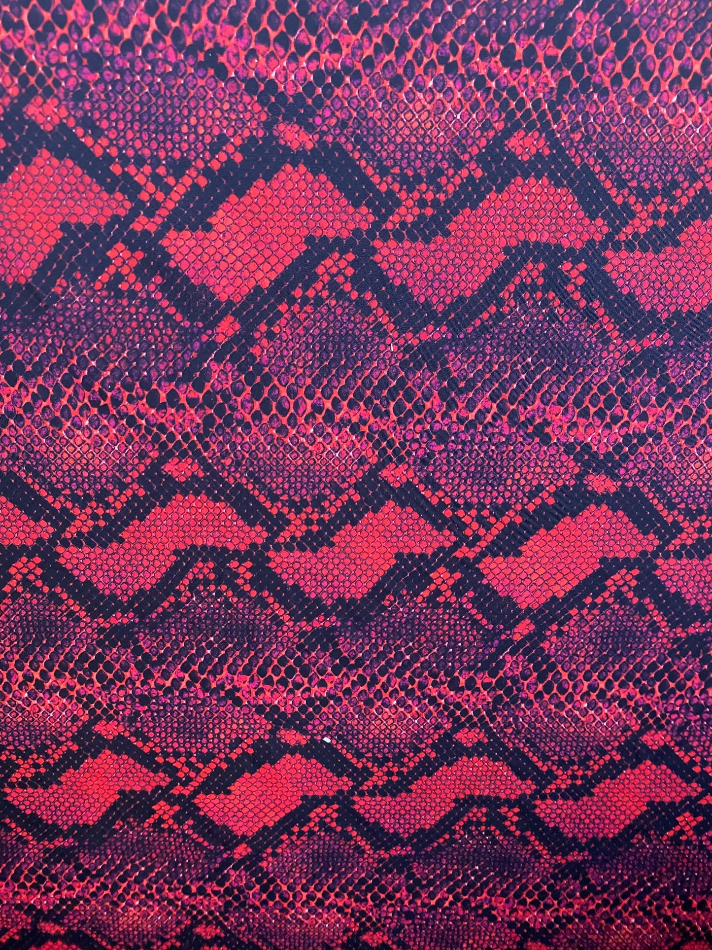 Serpent design Red/black print on nylon spandex 4-way stretch 58/60” Sold  by the YD. Ships worldwide from Los Angeles California USA.