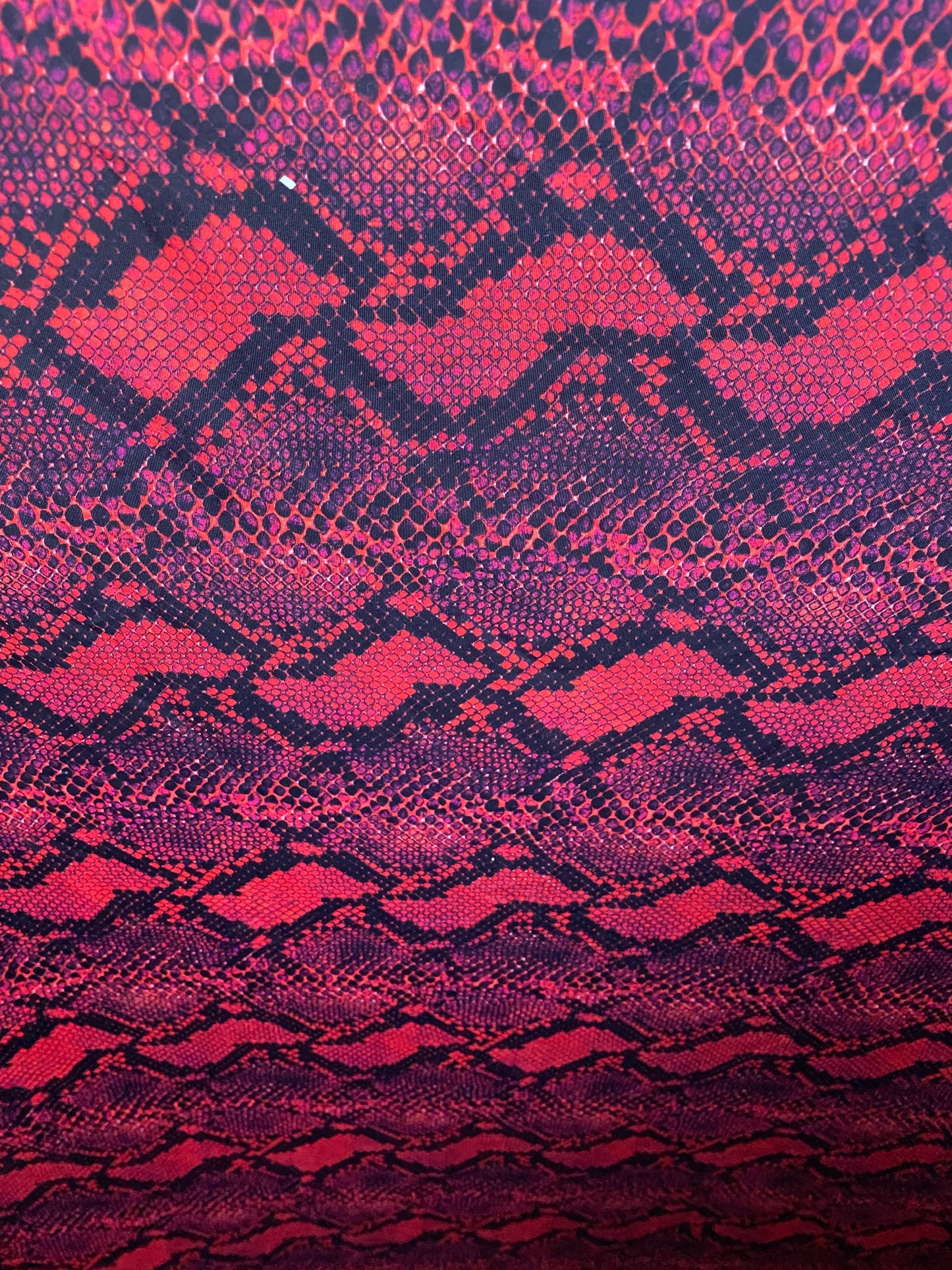Serpent design Red/black print on nylon spandex 4-way stretch 58/60” Sold  by the YD. Ships worldwide from Los Angeles California USA.