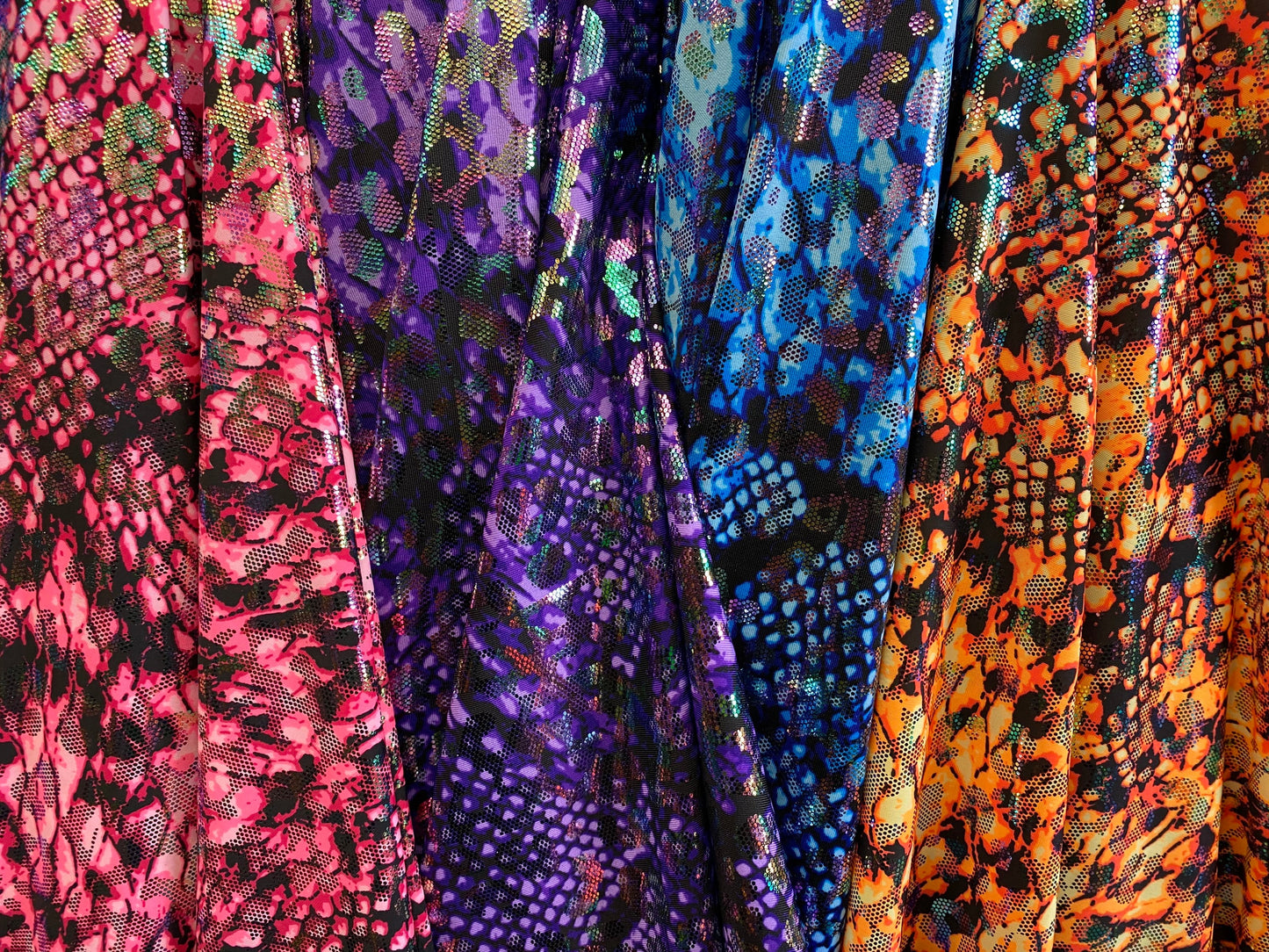 Iridescent metallic nylon spandex Cobra design 4way stretch 58/60” Sold by the YD. Ships worldwide from Los Angeles California USA