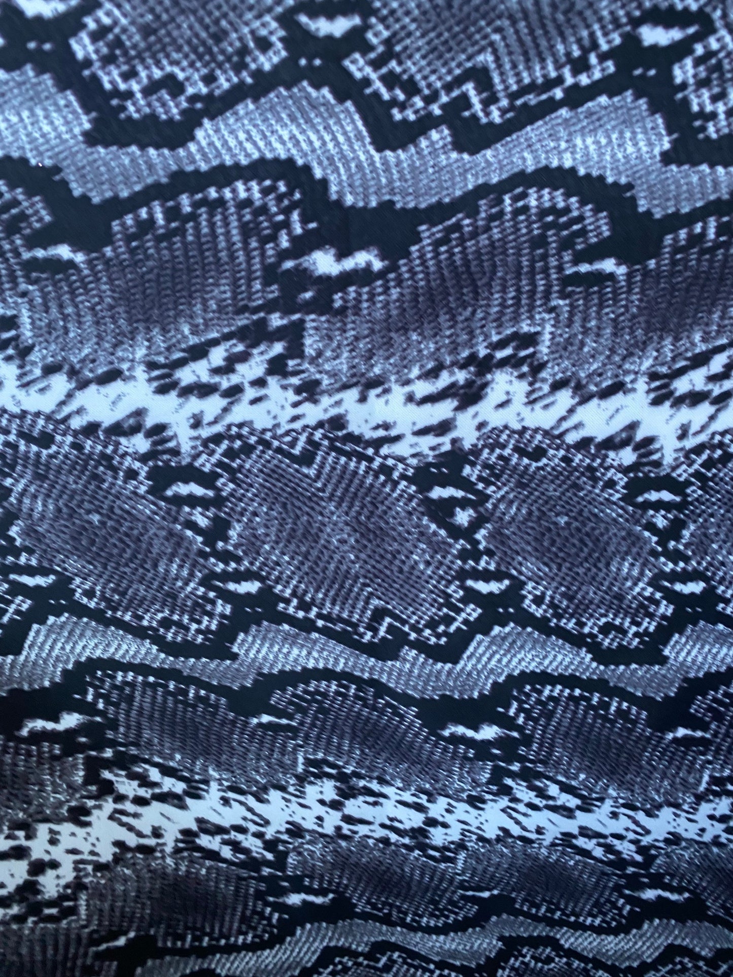 New exotic snake design gray/white/black print on poly techno 2-way stretch medium weight 58/60” Sold by the YD. Ships worldwide