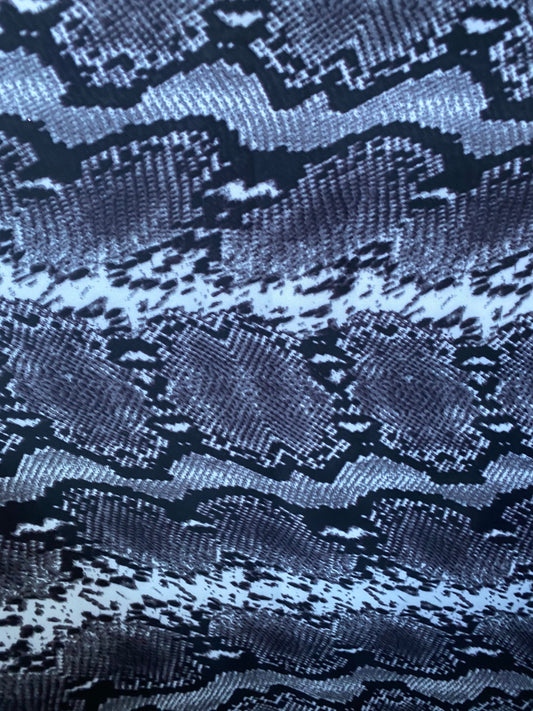 New exotic snake design gray/white/black print on poly techno 2-way stretch medium weight 58/60” Sold by the YD. Ships worldwide