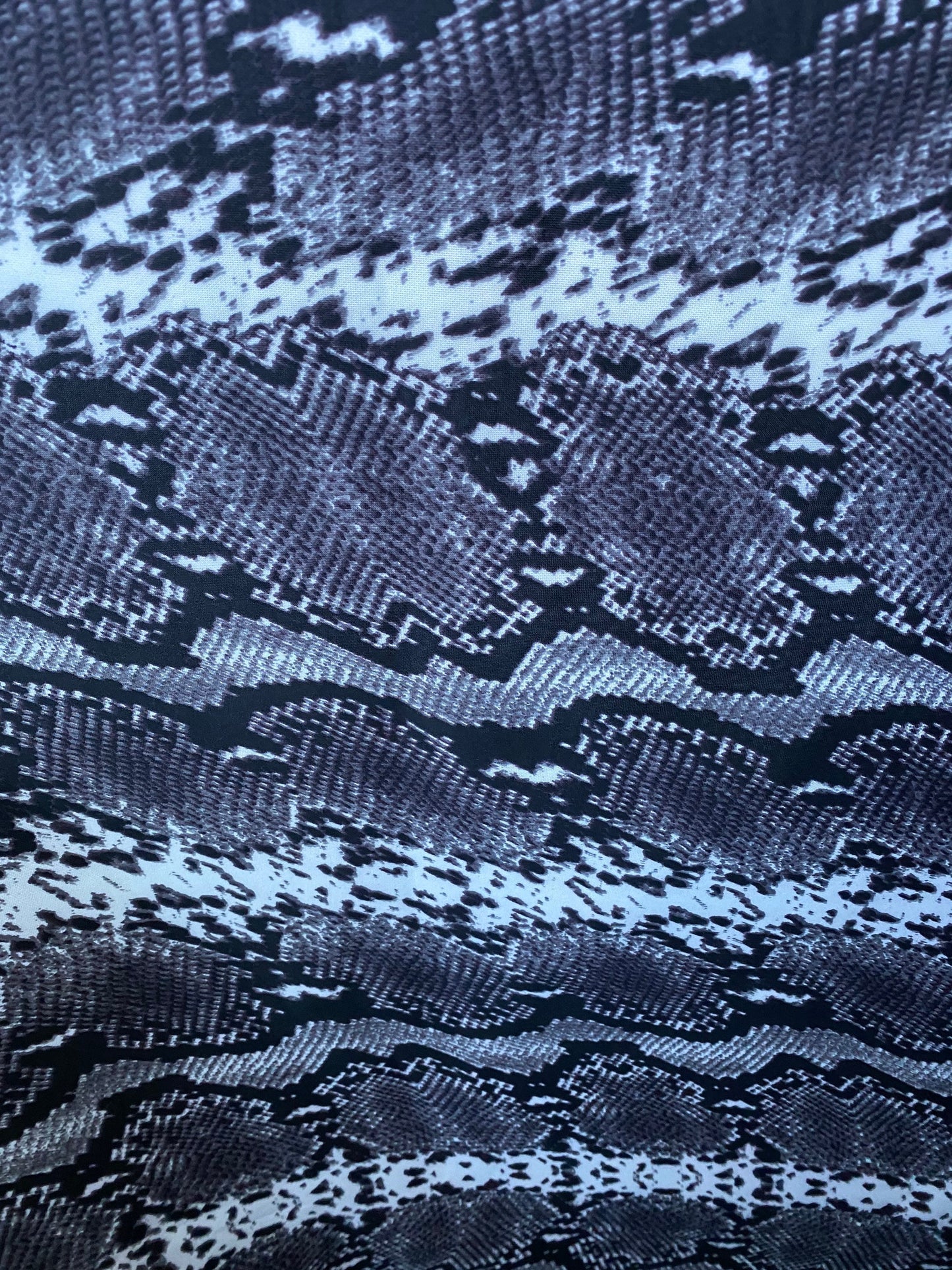 New exotic snake design gray/white/black print on poly techno 2-way stretch medium weight 58/60” Sold by the YD. Ships worldwide