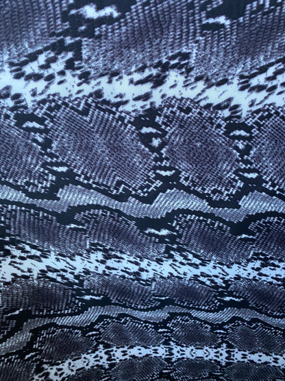 New exotic snake design gray/white/black print on poly techno 2-way stretch medium weight 58/60” Sold by the YD. Ships worldwide