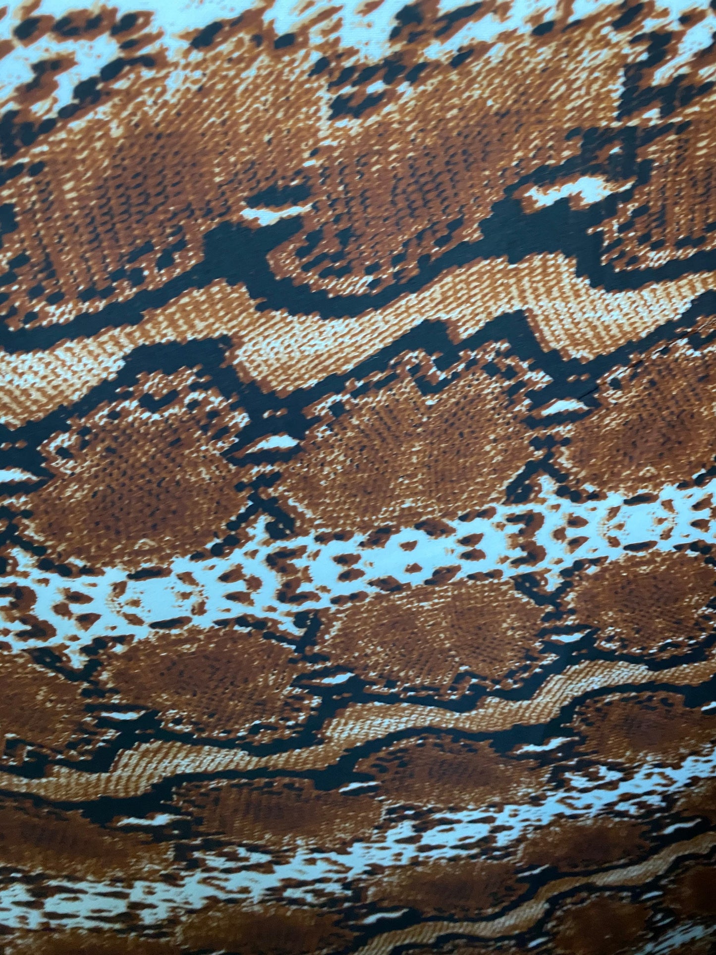 New exotic snake design taupe/black/white print on poly techno 2-way stretch medium weight 58/60” Sold by the YD. Ships worldwide