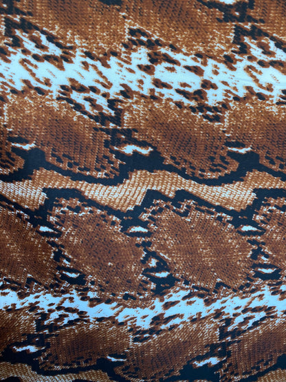 New exotic snake design taupe/black/white print on poly techno 2-way stretch medium weight 58/60” Sold by the YD. Ships worldwide