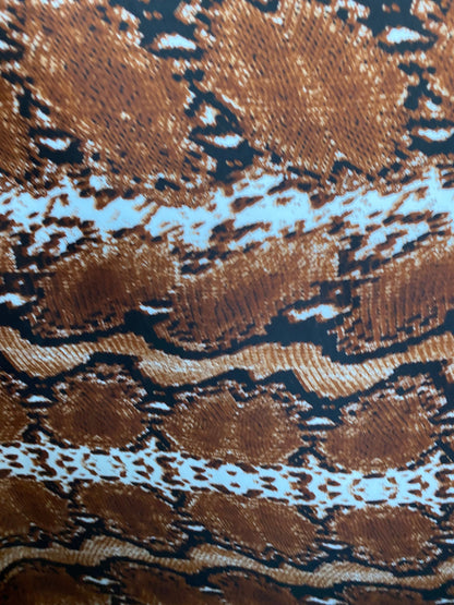 New exotic snake design taupe/black/white print on poly techno 2-way stretch medium weight 58/60” Sold by the YD. Ships worldwide