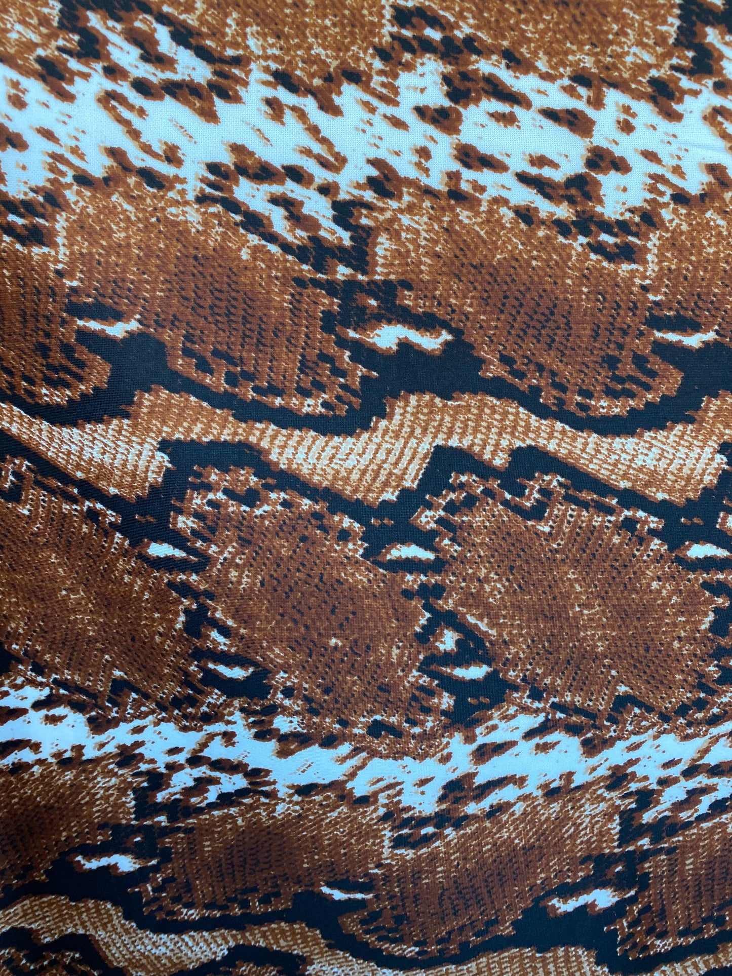 New exotic snake design taupe/black/white print on poly techno 2-way stretch medium weight 58/60” Sold by the YD. Ships worldwide