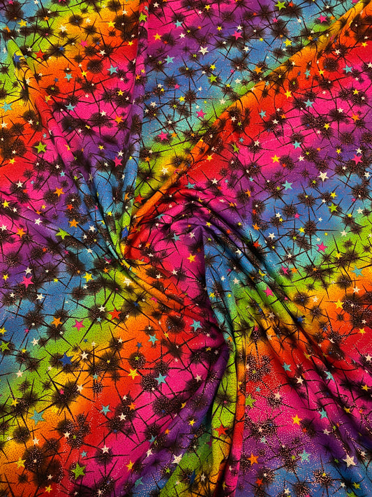 New rainbow Vegas design multi stars nylon spandex with foil 4-way stretch 58/60” Sold by the YD. Ships worldwide from Los Angeles CA USA.