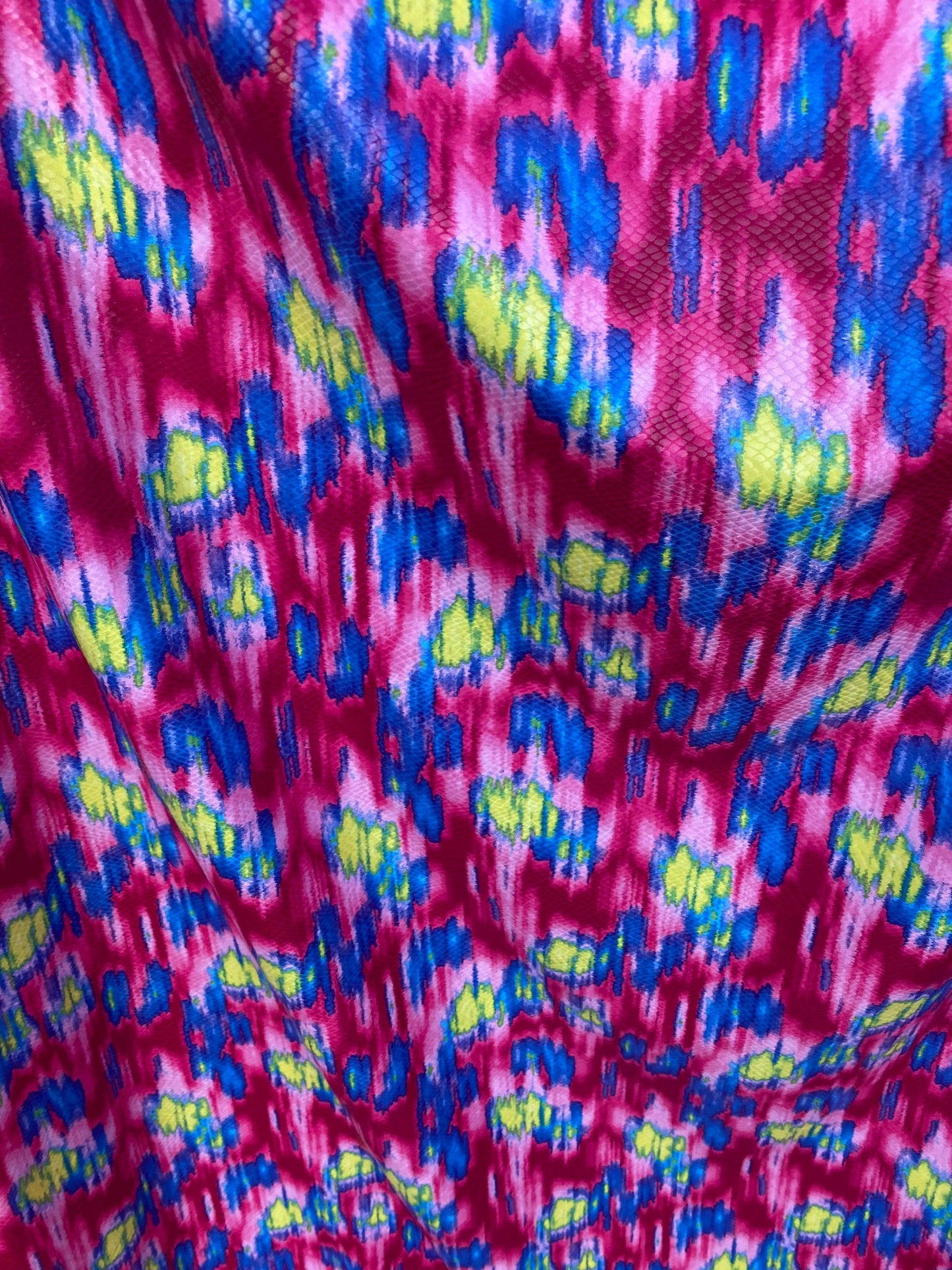 New Lava design with snake skin clear foil grate quality of poly spandex medium weight 2-way stretch 58/60” Sold by the YD.