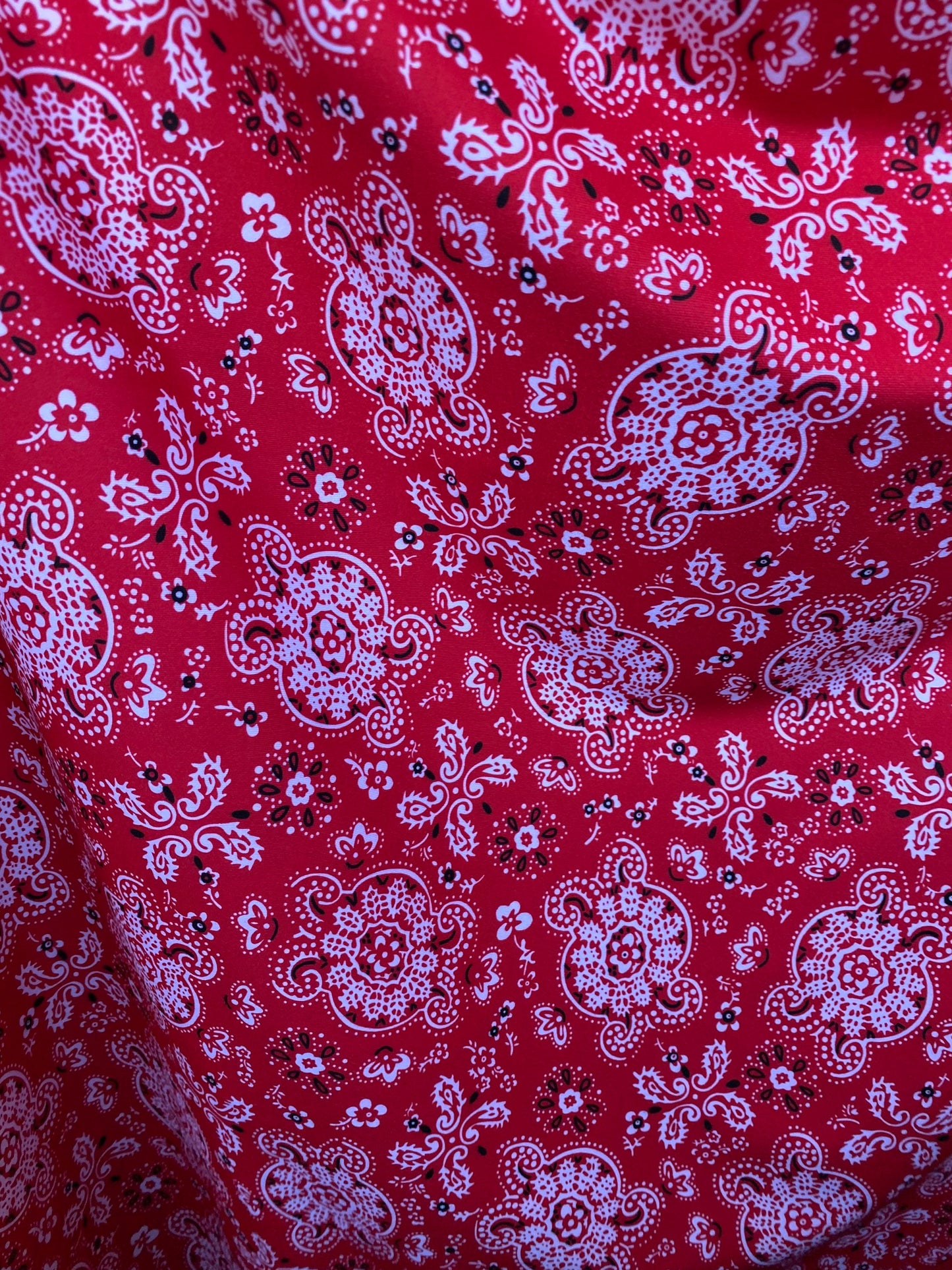 Red bandana design print on great quality of brushed poly spandex 4-way stretch medium weight 58/60” Sold by the YD.