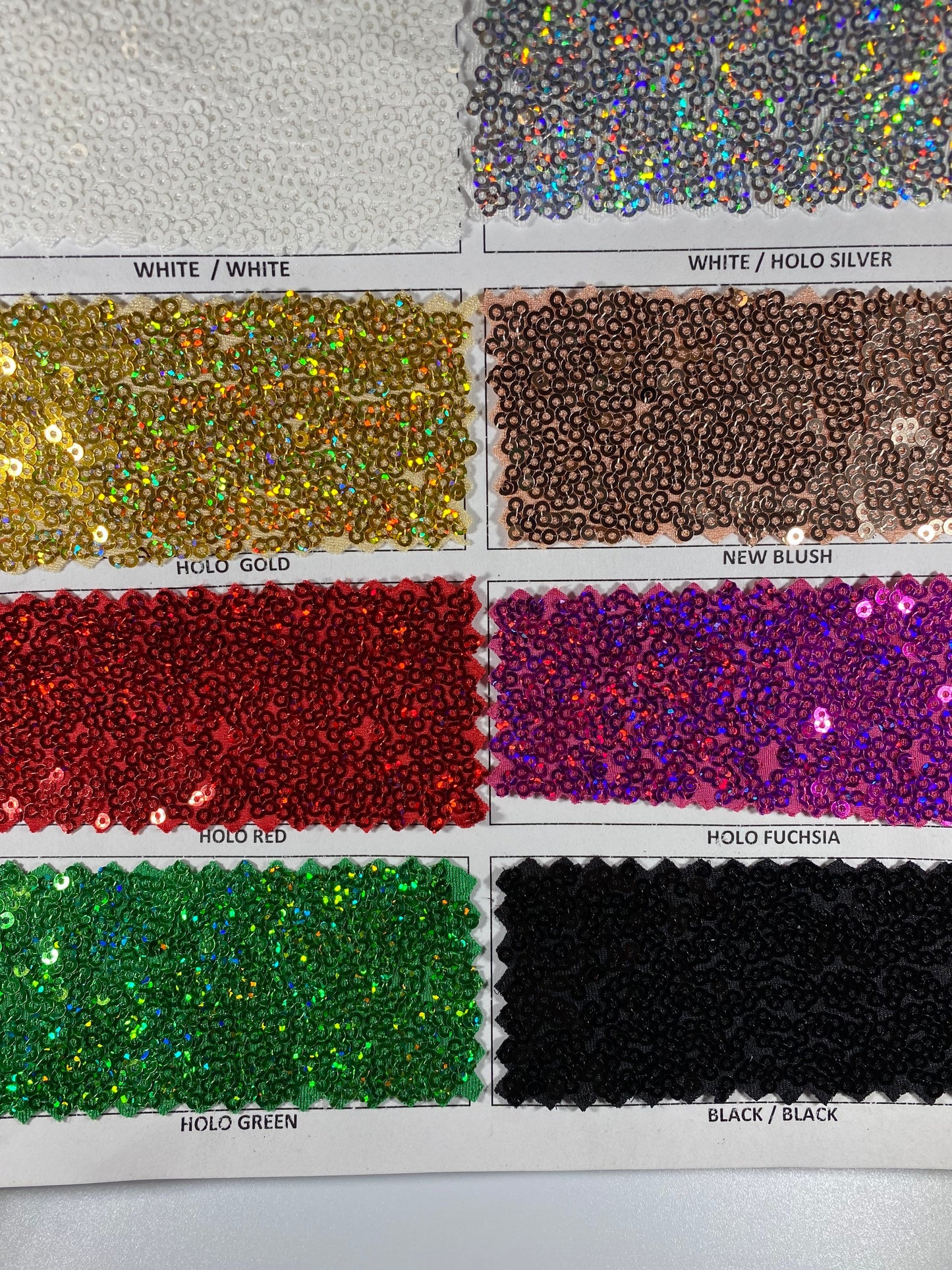 New Cosmic glitz sequins embroidered holographic micro sequins on solid spandex 4-way stretch 54/55” Sold by the YD.