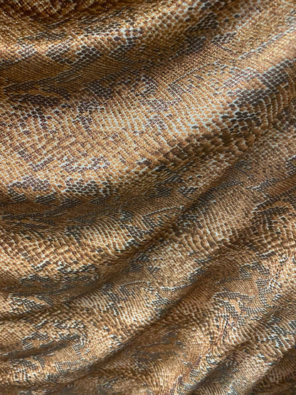 New exotic snake design metallic hologram poly spandex bronce color médium weight 2-way Stretch 58/60" Sold by the YD. Ships worldwide