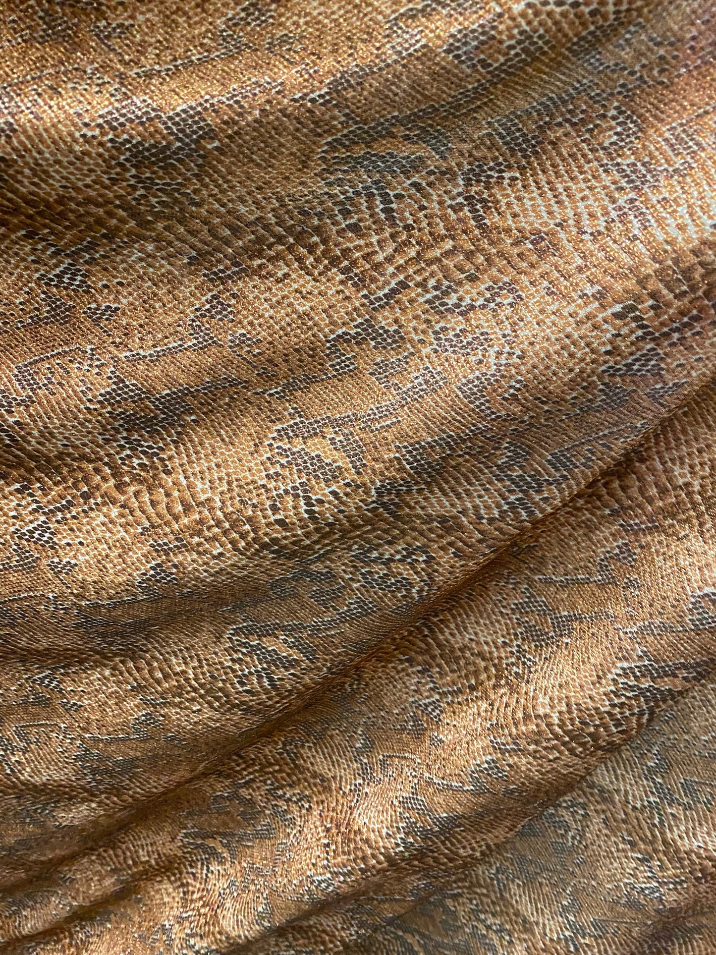 New exotic snake design metallic hologram poly spandex bronce color médium weight 2-way Stretch 58/60" Sold by the YD. Ships worldwide
