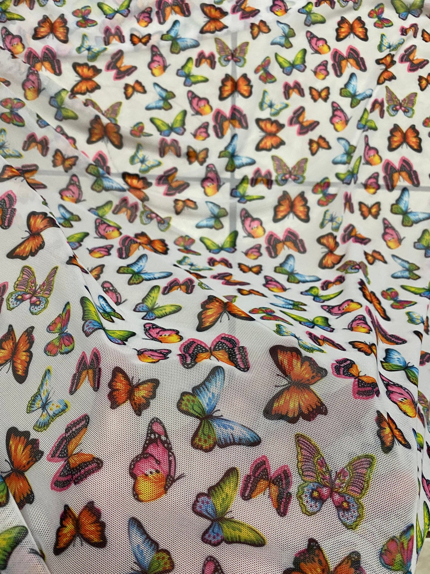 New butterflies design multicolor print on good quality stretch power mesh 4-way stretch 58/60” Sold by the YD. Ships worldwide from Los Ang