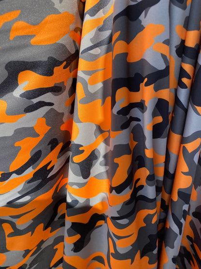 New modern camouflage Orange/black/Gray print on great quality of nylon spandex 4-way stretch 58/60” Sold by the YD.