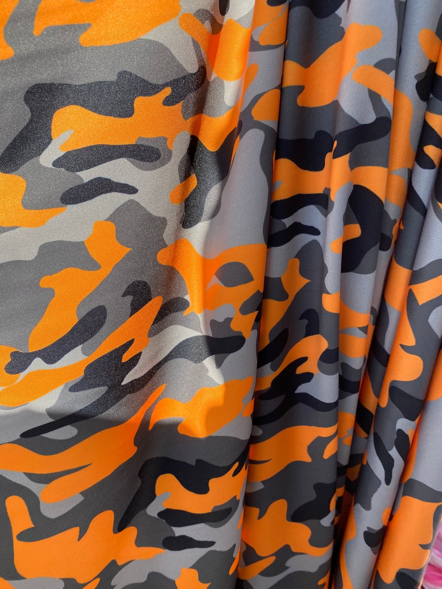 New modern camouflage Orange/black/Gray print on great quality of nylon spandex 4-way stretch 58/60” Sold by the YD.