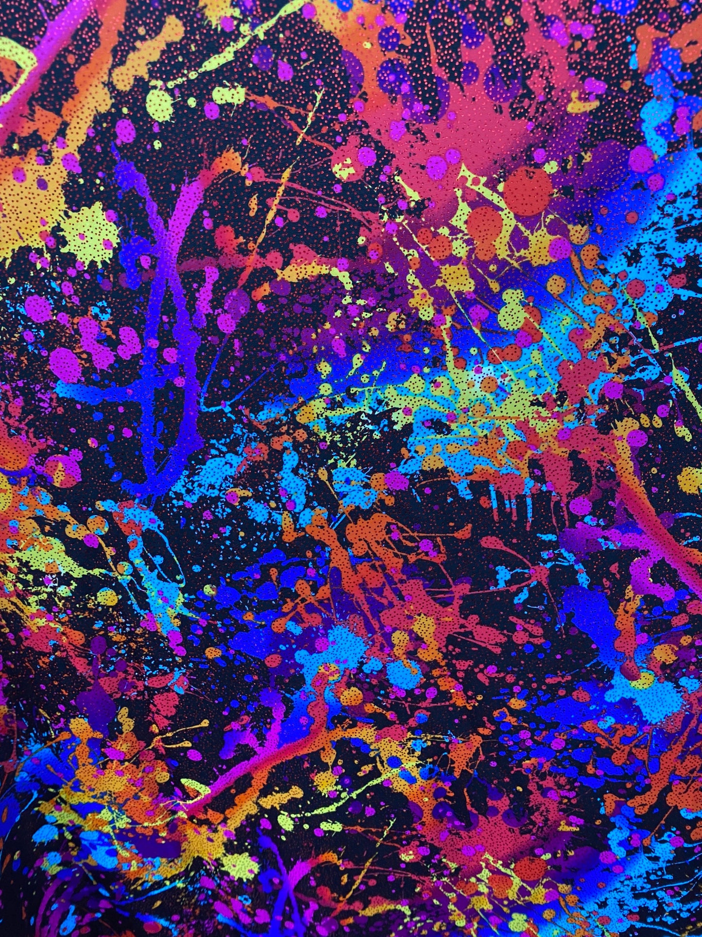 Graffiti paint design multi nylon spandex with foil 4-way stretch 58/60” sold by the YD. Ships worldwide from Los Angeles California.