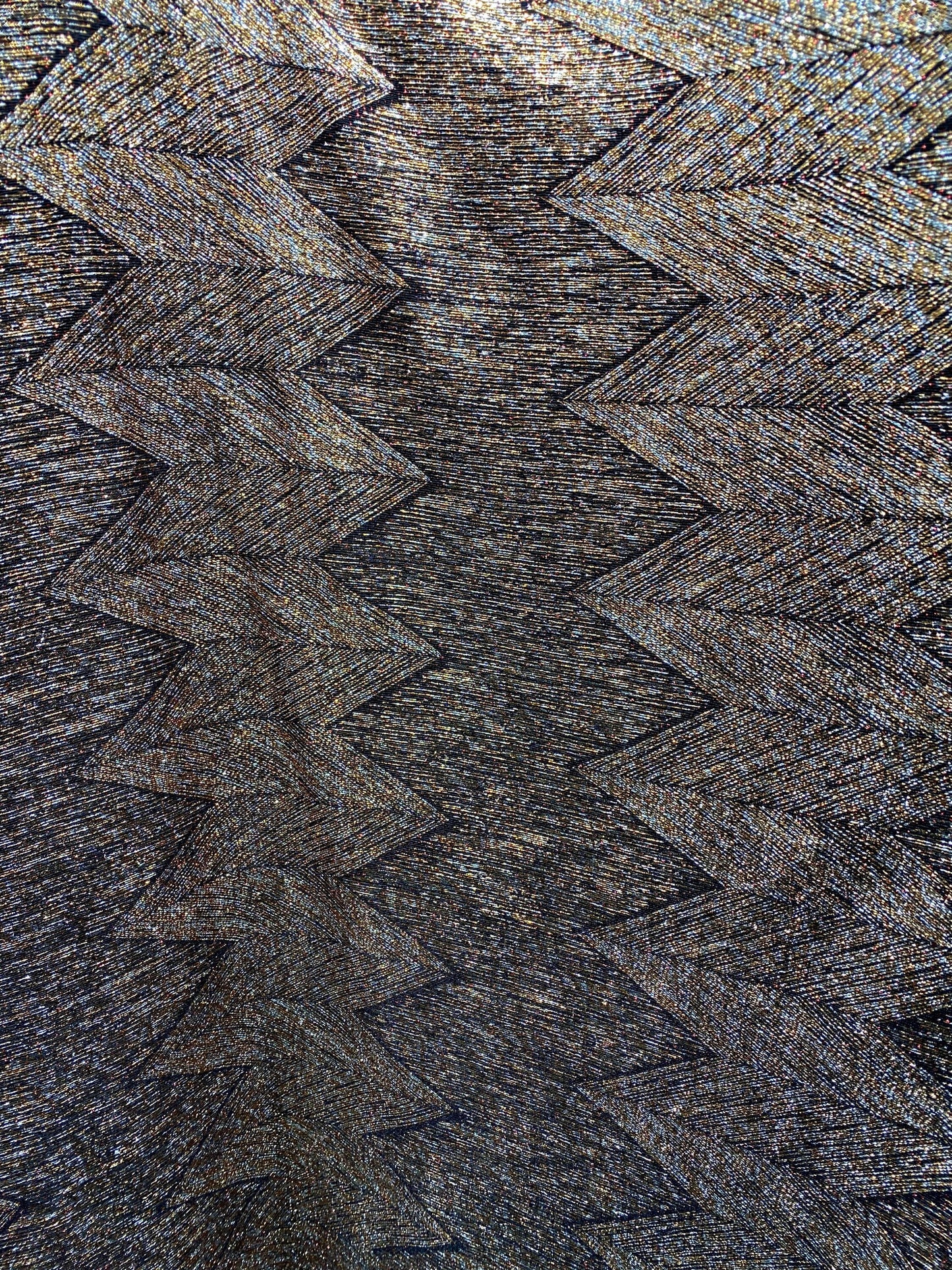 New geometric zigzag design metallic poly spandex bronze color medium weight 4-way stretch 58/60” Sold by the YD. Ships Worldwide from L.A