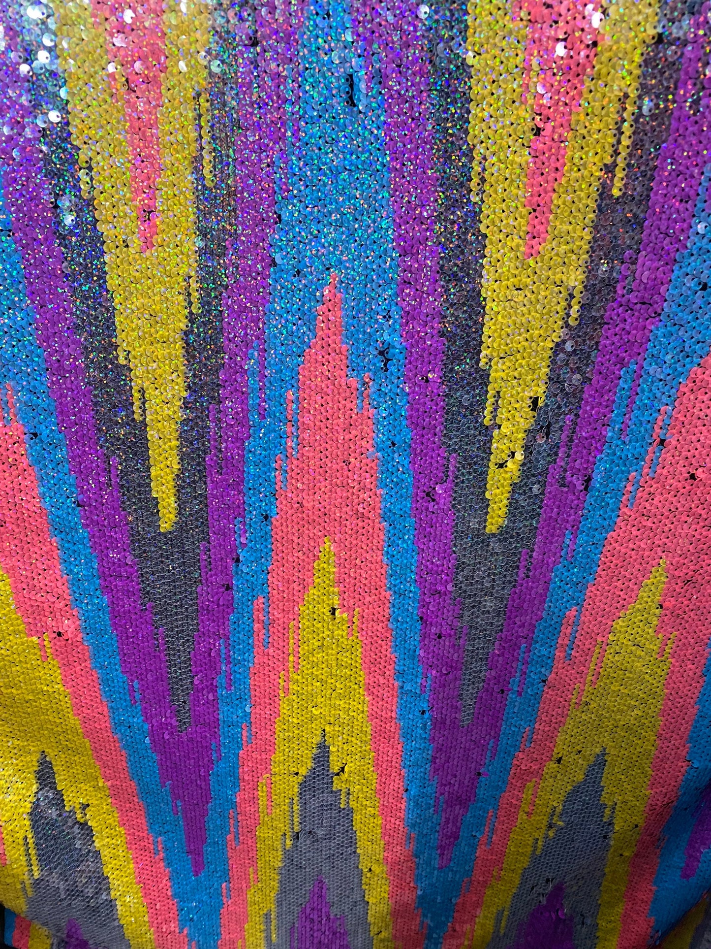 New chevron design multicolor rainbow sequins on stretch mesh 2-way 55/57” Sold by the YD. Ships worldwide from Los Angeles California USA.