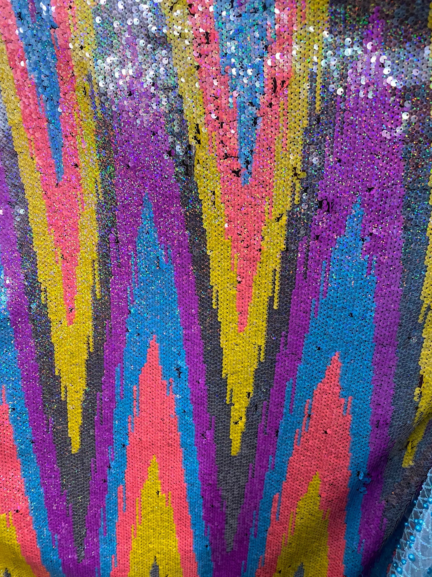 New chevron design multicolor rainbow sequins on stretch mesh 2-way 55/57” Sold by the YD. Ships worldwide from Los Angeles California USA.