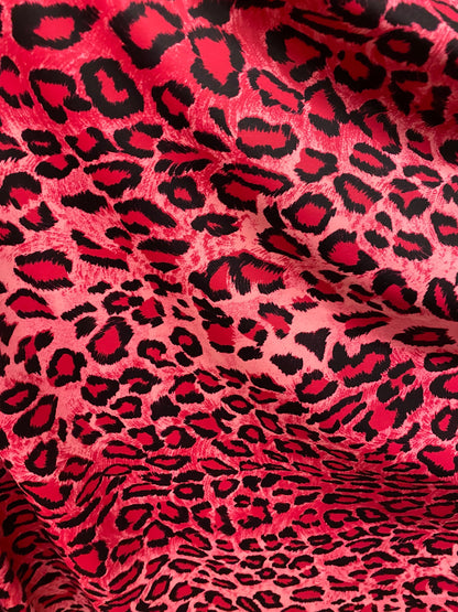 Exotic leopard design pink/black print on nylon spandex 4-way stretch 58/60” Sold by the YD. Ships worldwide from Los Angeles California U