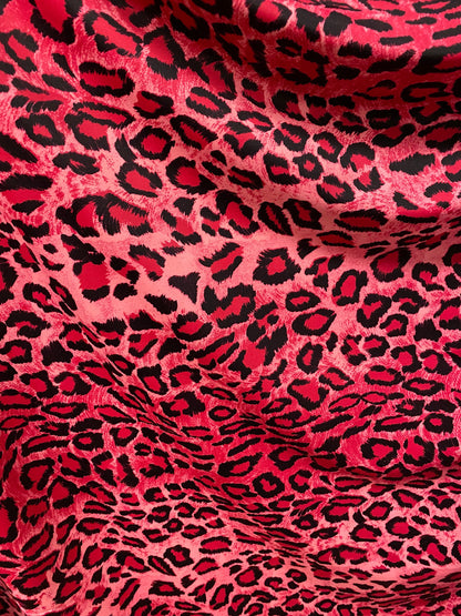 Exotic leopard design pink/black print on nylon spandex 4-way stretch 58/60” Sold by the YD. Ships worldwide from Los Angeles California U