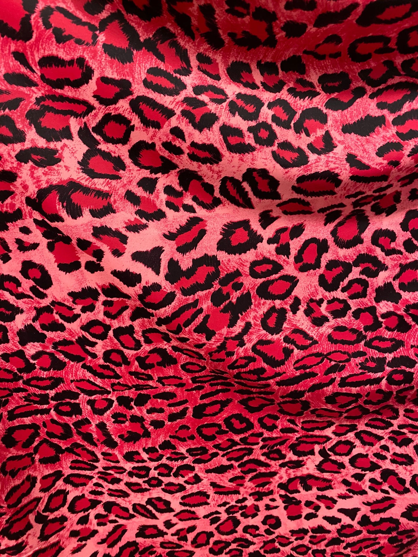 Exotic leopard design pink/black print on nylon spandex 4-way stretch 58/60” Sold by the YD. Ships worldwide from Los Angeles California U