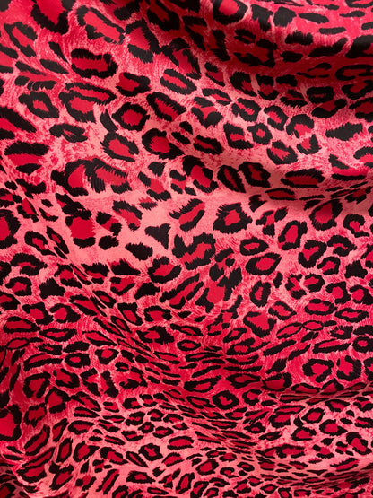 Exotic leopard design pink/black print on nylon spandex 4-way stretch 58/60” Sold by the YD. Ships worldwide from Los Angeles California U