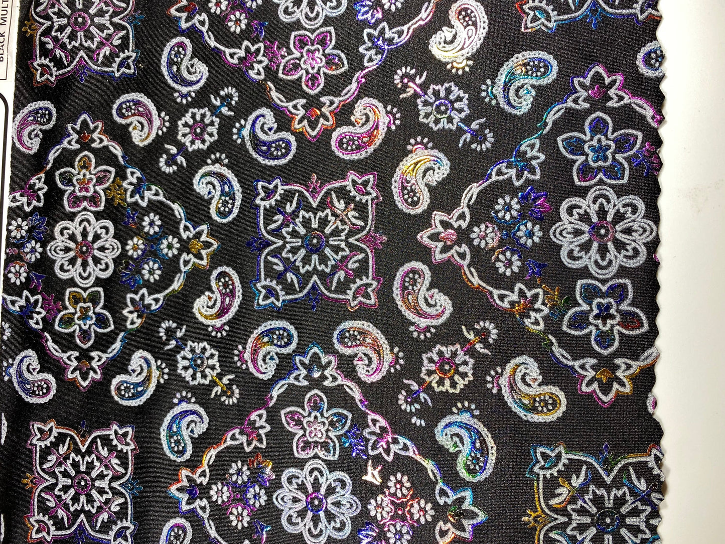 New Bandana paisley design black/rainbow metallic nylon spandex 4-way stretch 58/60” Sold by the YD. Ships Worldwide from Los Angeles cali