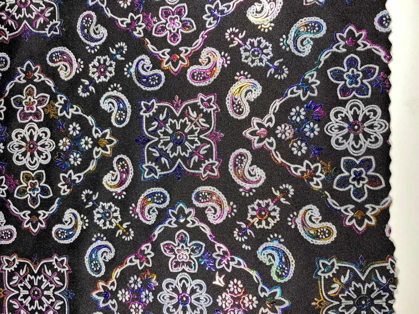 New Bandana paisley design black/rainbow metallic nylon spandex 4-way stretch 58/60” Sold by the YD. Ships Worldwide from Los Angeles cali