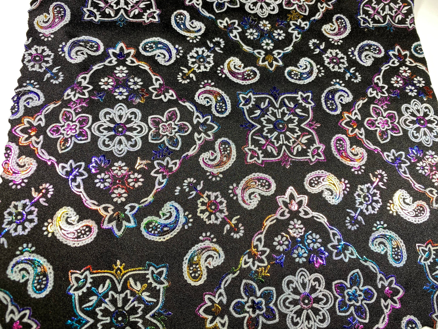 New Bandanna paisley design black/rainbow metallic nylon spandex 4-way stretch 58/60” Sold by the YD. Ships Worldwide from Los Angeles cali