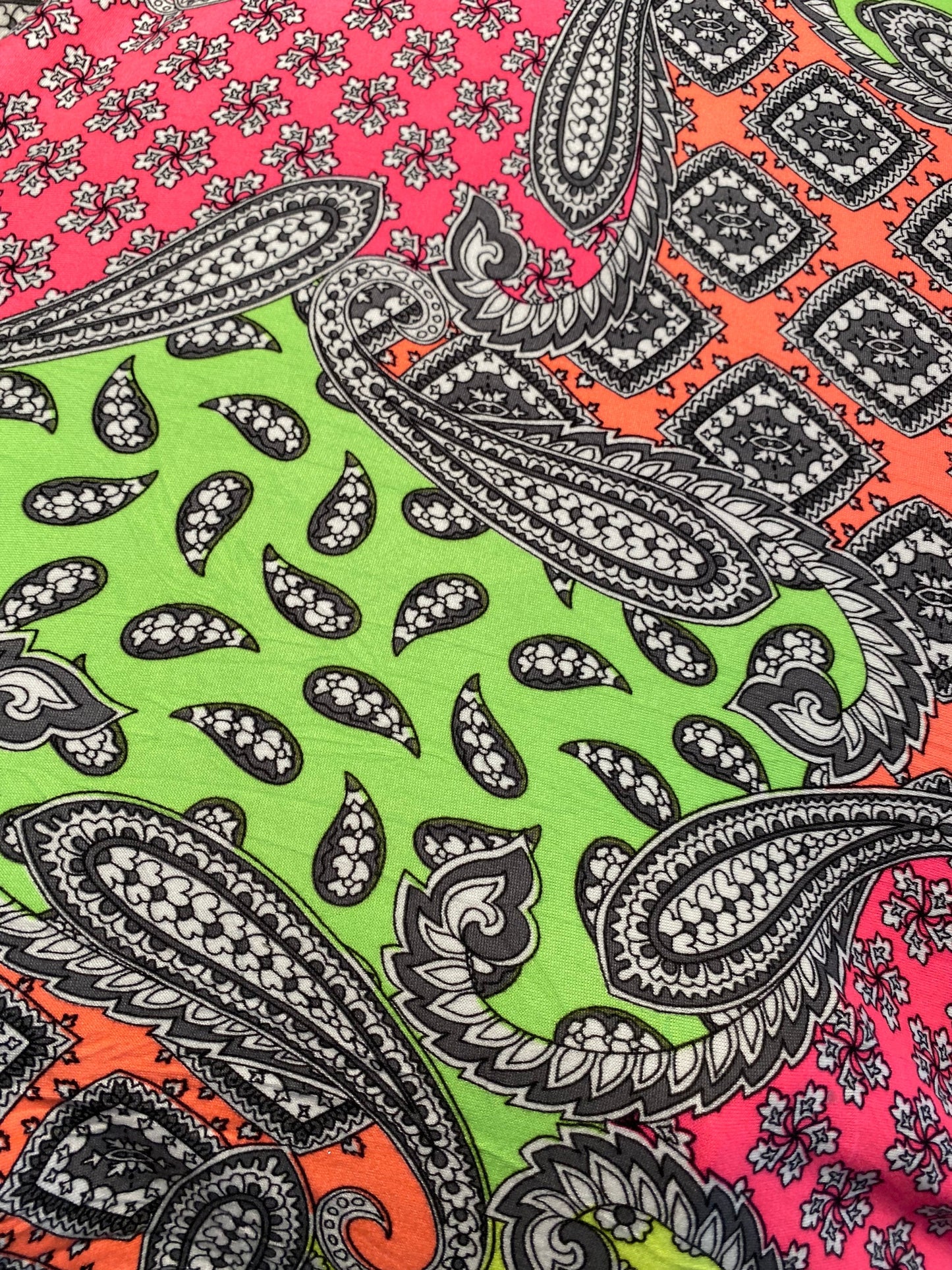 New paisley designs neon colors print on poly spandex jersey 4-way stretch medium weight 58/60” Sold by the YD. Ships Worldwide from L.A CA.